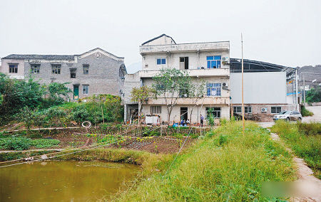 田學明家的3層小樓